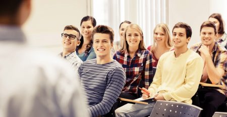 group of students and teacher with notebook