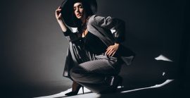 Woman Model In A Business Suit Wearing A Hat In A Studio Woman Model In A Business Suit Wearing A Hat In A Studio
