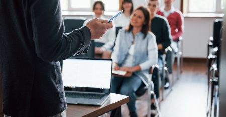 Everyone Is Smiling And Listens Group Of People At Business Conference In Modern Classroom At Daytime Everyone Is Smiling And Listens Group Of People At Business Conference In Modern Classroom At Daytime